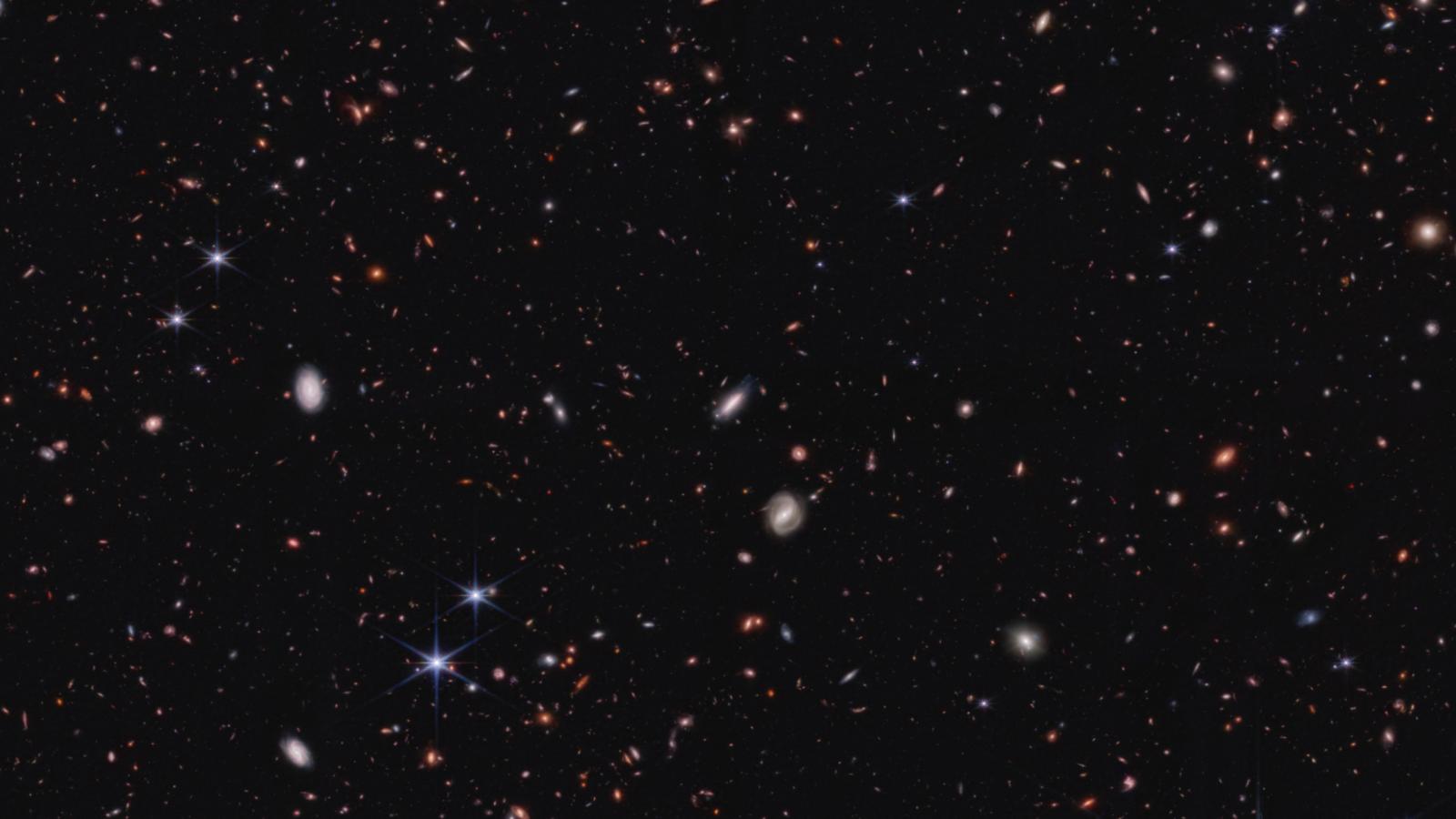 immagine dell'universo profondo con galassie stelle e sfondo nero